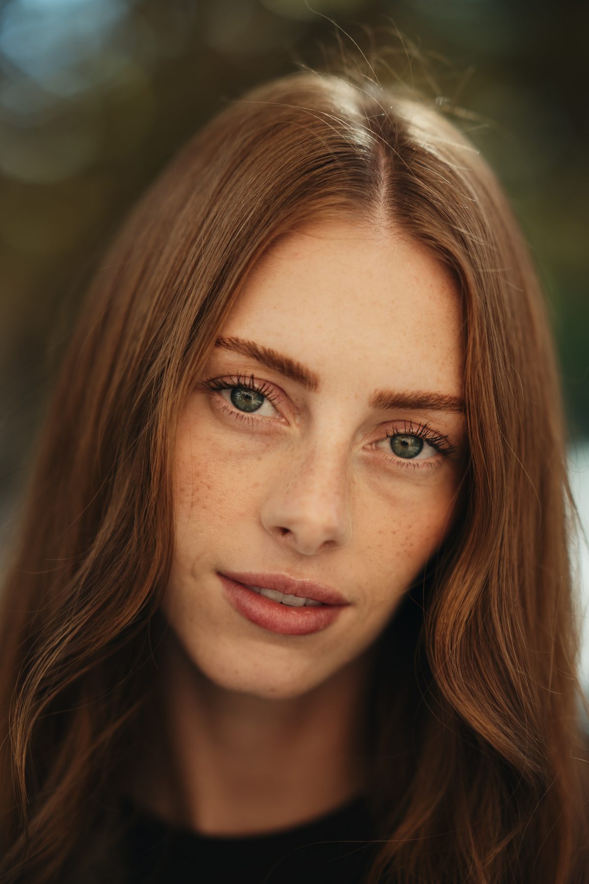 A woman with long red hair and freckles, edited with Marfil