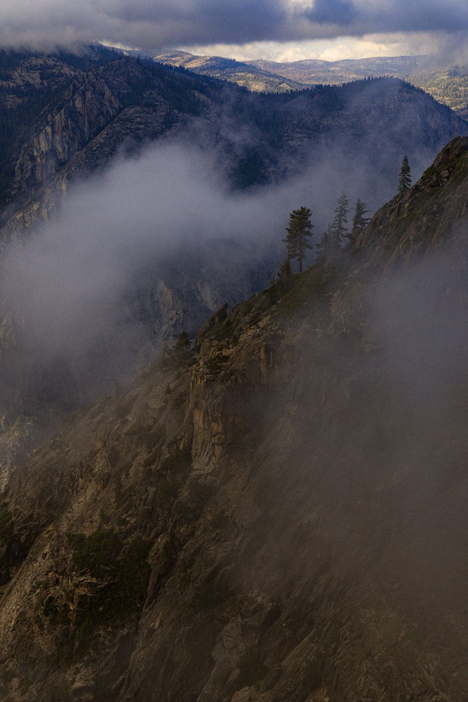 Mist rolling over a mountain ridge